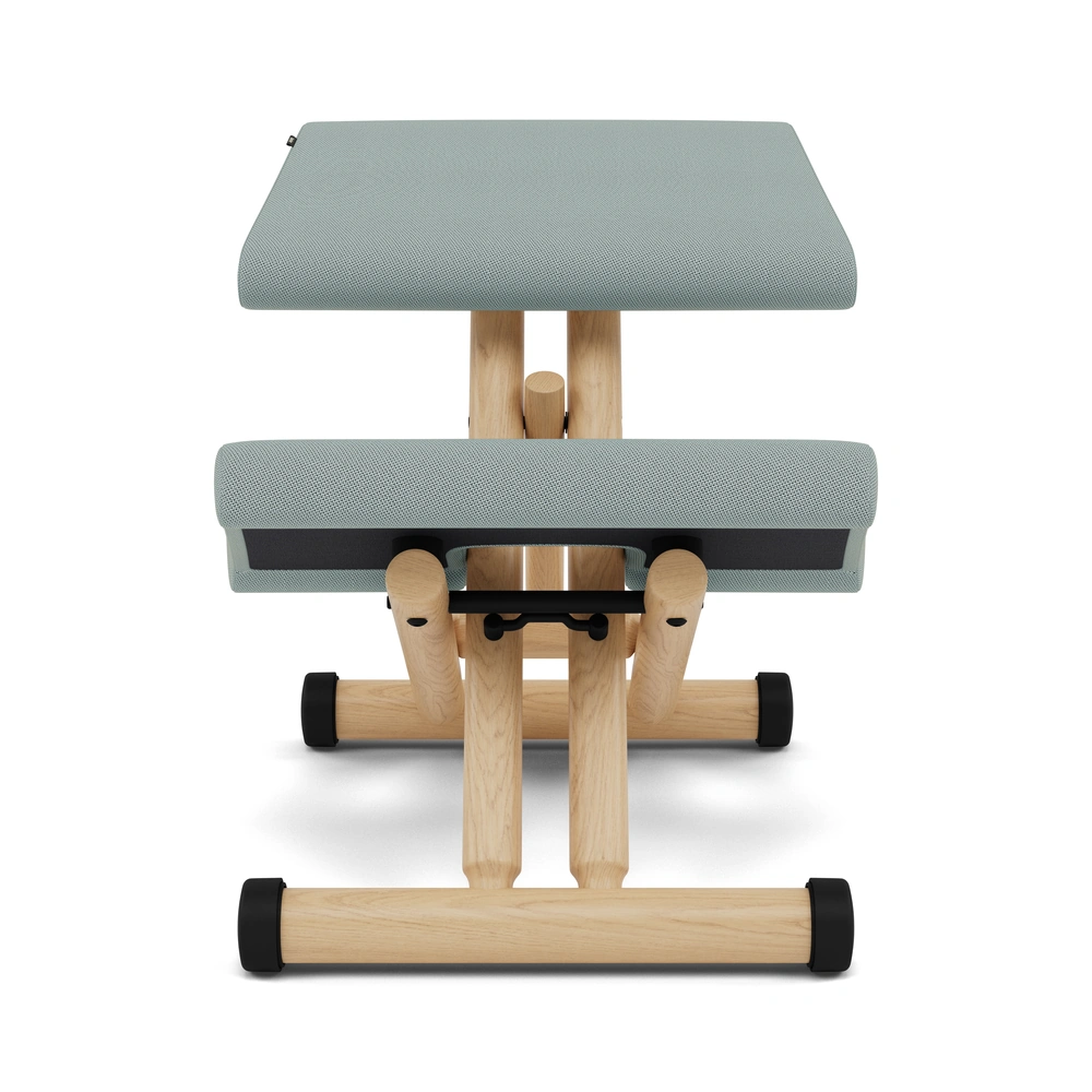 Varier Multi kneeling chair in Tonal Light Green fabric with natural wood base